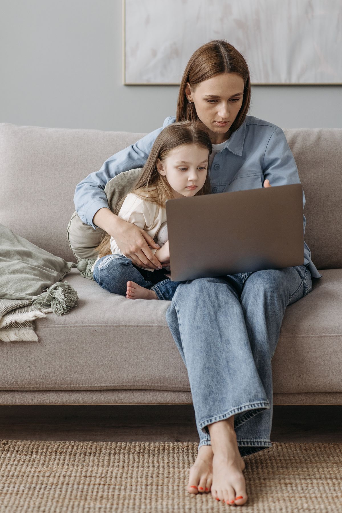 A family comparing internet, TV, phone, and mobile plans together at home